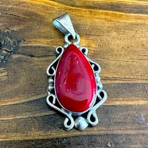 Sterling 925 silver pendant. Made in Mexico. Red stone.
